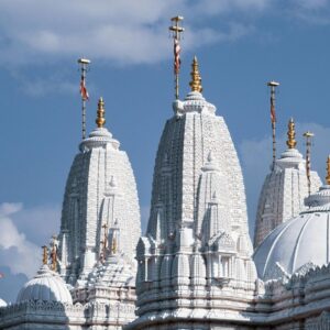 "Grand marble mandir with intricate pillars, dome, and inlay work – best marble mandir design for home"