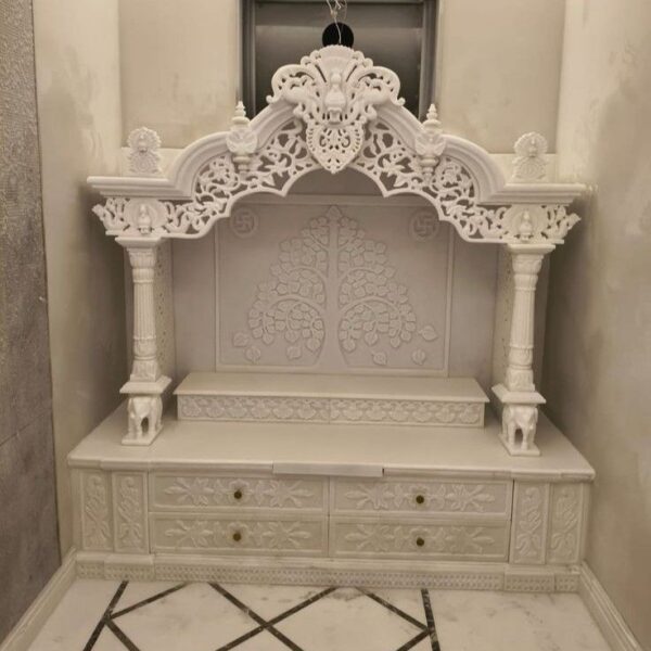 Handcrafted white marble mandir for home pooja room with carving