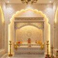 Custom white marble temple for apartments with carved jali and traditional Hindu mandir design